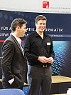 Am Infopoint der Konferenz: Serkan Glatt und Leif Janßen (v.l.), ITMC-Studierende der Universität Hamburg, begrüßten die Teilnehmerinnen und Teilnehmer der ITMC Conference 2011. Foto: Regine Dörbecker